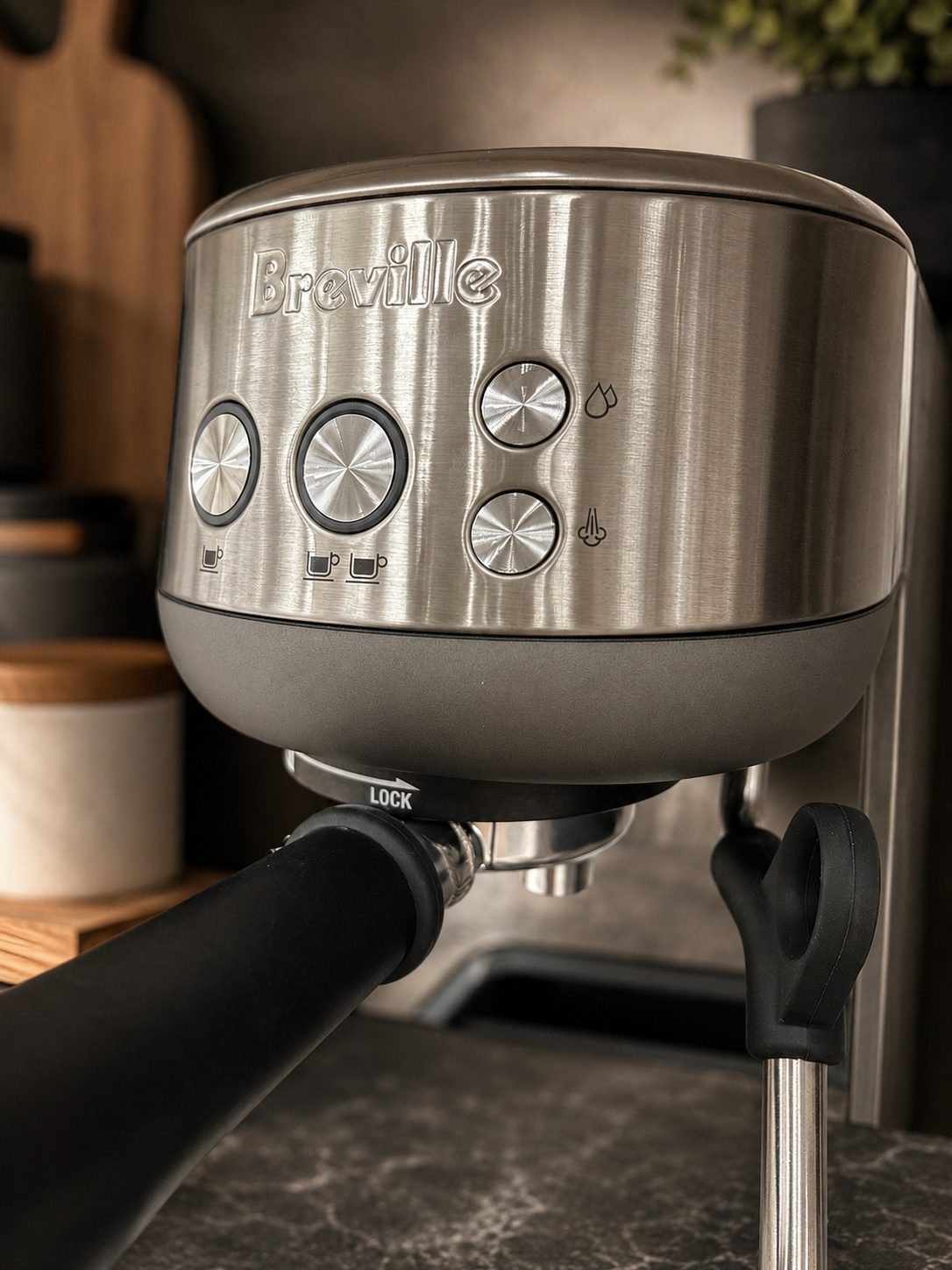 Breville Bambino controls, portafilter, and steam wand detail