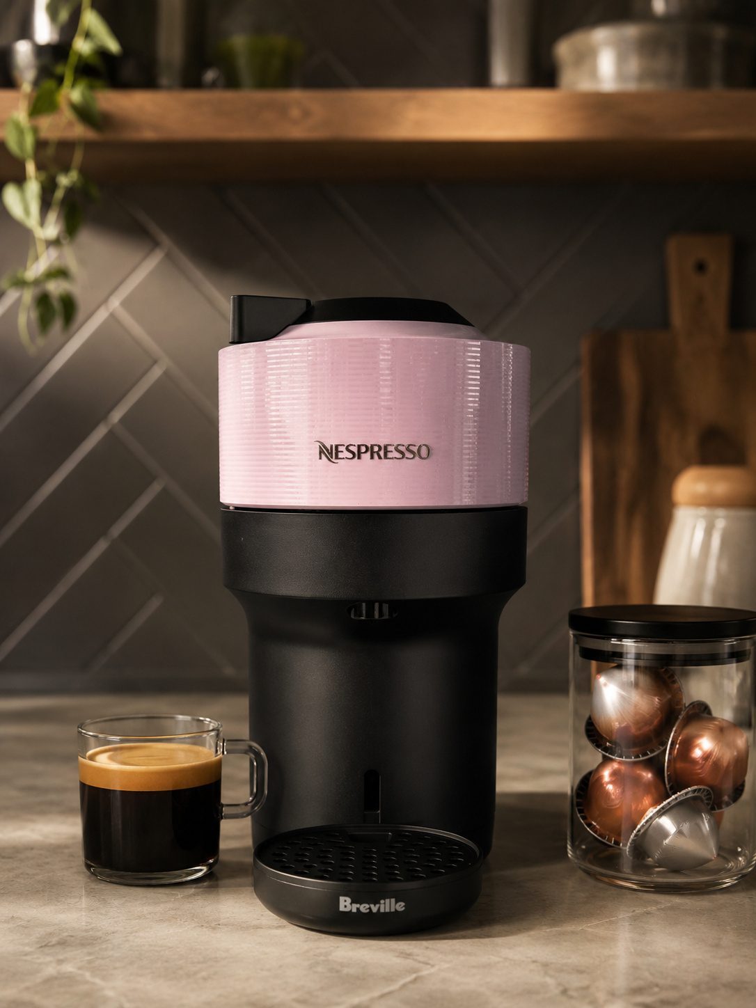 Nespresso Vertuo Pop Plus pod coffee machine in pink on a kitchen counter